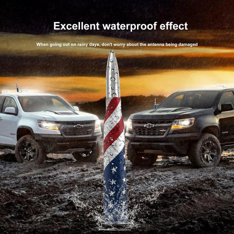 Bullet Antenna Replacement Mast With Valve Stem Caps American Flag Style in mud, GMC Sierra and Chevy Silverado in background