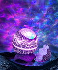 Dinosaur Eggs Galaxy Star Projector With Bluetooth Nebula LED Night Light emitting colorful nebula pattern on ceiling.