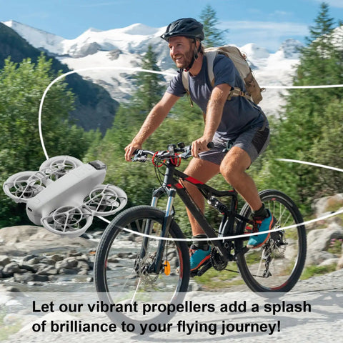 Cyclist with mountain backdrop and Colorful Drone Propellers For Neo 2 Quiet Low Noise Paddle Style Replacement in flight