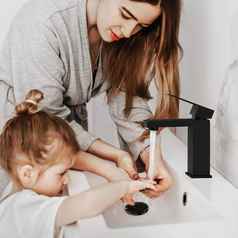 Mother and child using Matte Black Bathroom Faucet Set 2 Pack For Single Hole Vanity Sinks Stainless Steel 18 8 Lead Free NSF And CUPC Certified Easy Install Durable Modern Look