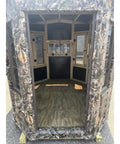 Interior view of Kick Ass Solid 6X8 Wooden Deer Blind Featuring Hella Warm R6 Insulation Panels Amish Crafted Hunting Shooting House.