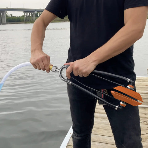 Heavy Duty Steel Boat Motor Flusher With Dual Flow Muff Style Five Eighths Inch Garden Hose Connection in use by water