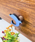 Blue dolphin shape from 8 Pack Ocean Sea Animal Wooden Cabinet Knobs Set With Tiny Turtle Decor For Nursery And Kids Rooms.
