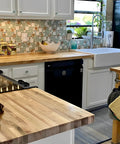 Kitchen backsplash with Coastal Beach Glass Stone Mosaic Tile in lake green, white, and sandstone shell accents on 12x12 mesh sheets.
