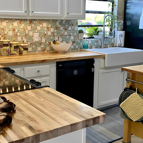 Kitchen backsplash with Coastal Beach Glass Stone Mosaic Tile in lake green, white, and sandstone shell accents on 12x12 mesh sheets.