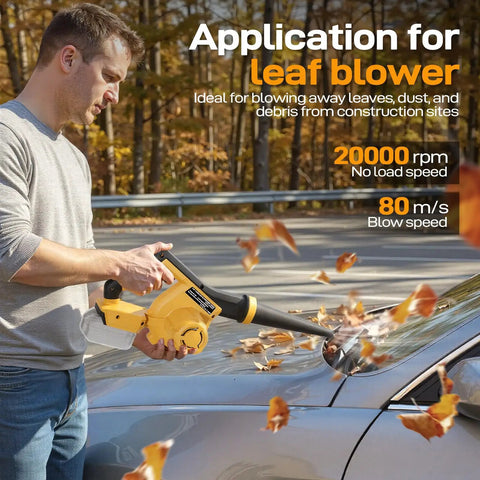 Man using cordless handheld leaf blower to clear leaves from car