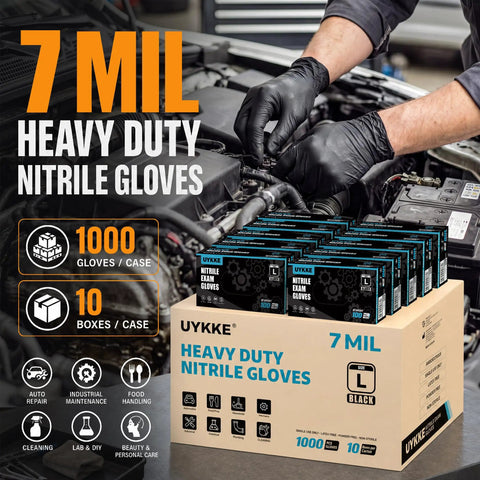 Heavy Duty 7 Mil Black Nitrile Disposable Gloves For Mechanics Built Different Rock Solid Puncture Resistance And Dang Good Grip Packaged In A Slick Dispenser Box, shown in a workshop amidst tools.