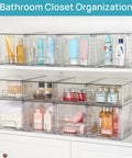 Four Pack Large Clear Stackable Storage Drawers With Smooth Pull Out Slides And Grippy Silicone Pads For Super Neat Closets That Keep Your Belongings Squared Away Daily in a bathroom closet.