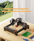 Longer portable laser engraver on black metal frame with red laser module on wood table.