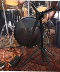 Slick Black Tripod Drum Stand With Heavy Duty Snare Rack And Practice Pad Holder Featuring Adjustable Heights in a jam session.