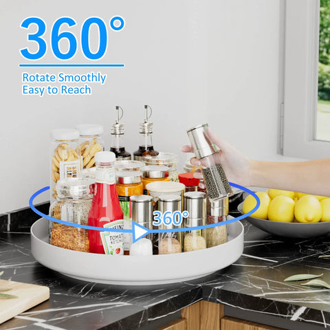 Hella Rugged 13 Inch Metal Lazy Susan Turntable For Kitchen Cabinet And Pantry Rack Storage White filled with spice jars on countertop.