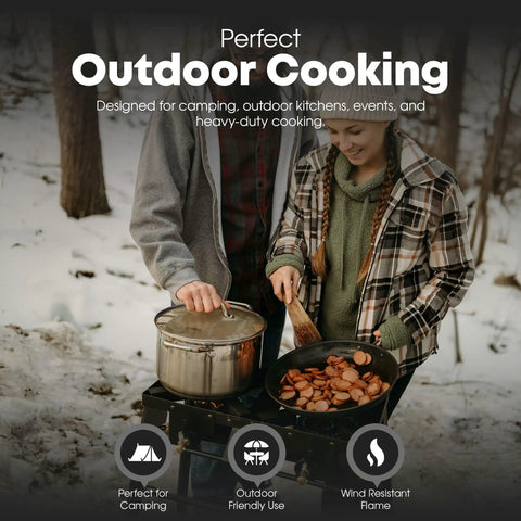 Couple cooking on Double Propane Camp Burner With Adjustable Height and Removable Legs, outdoor setup in snowy woods