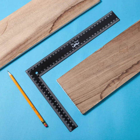 Metal Carpenter Square Ruler L Shape Right Angle 8 By 12 Inch With Imperial And Metric Measurements One Sixteenth Inch Graduations with pencil and wood planks.