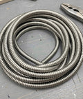Top Notch Flexible Stainless Steel Wire Loom Sleeve For Heavy Duty Cable Management, 5mm ID, silver, coiled for wiring projects.