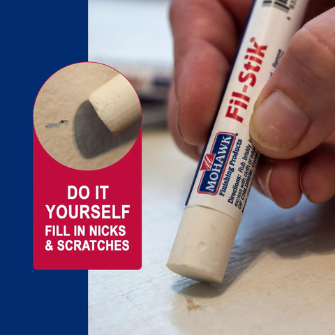 Pro Level Off White Wood Repair Putty Stick For Fixing Furniture Scratches And Trim Gouges Easy Glide Wax Filler Kit being used.
