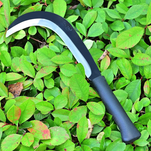 Beast Mode Machete Sickle for weed removal with magnetic long handle on green leaves, durable carbon steel blade