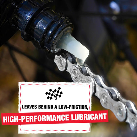 Application of One Step Bike Chain Cleaner And Lubricant For All Bicycle Chains on a bike chain, bottle dispensing liquid, 4 oz