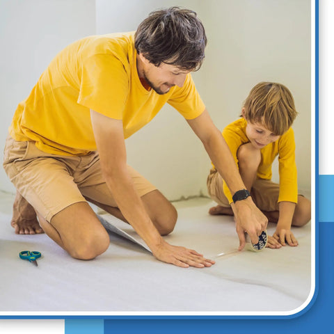 Father and son using Top Shelf White Foam Insulation Roll With Super Reflective Radiant Barrier Coating for home project.