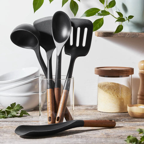 Silicone Wood Handle 5-Piece Cooking Utensil Set with BPA-Free Matte Black Silicone displayed on a kitchen counter