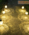4 Pack Solar Lanterns With Shepherd Hooks No Wiring Easy Setup Outdoor Color Changing Crackle Glass 3 Lumens Waterproof Garden Lights illuminating a path at night