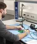 Technician using Blue ESD Soldering Mat 900 X 600 MM, Heavy Duty And Pro Grade, Heat, Solder, Chemical And Oil Resistant on desk