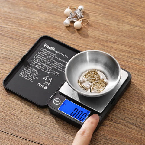 Ultra Accurate 0.01g Digital Pocket Scale With 500g Capacity For Lab Kitchen Coffee Jewelry And Food Black Portable Precision Weighing For On The Go Outdoors showing jewelry in a bowl on stainless steel tray.
