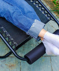 Two Pack Zero Gravity Chair Foot Rest Cushions For Outdoor Recliners in use, showing footpads attached to chair for comfort, black