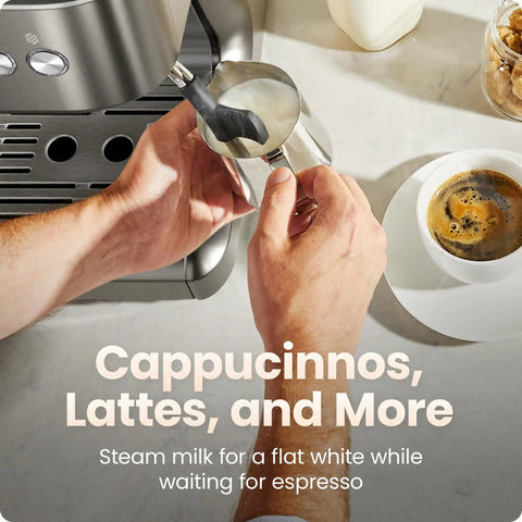 Person using Deluxe Espresso Machine With Double Boiler, Milk Frother And Steam Wand, Semi Automatic, Built In Grinder And 30 Grind Settings For Barista Quality At Home, Brew And Froth Simultaneously, steaming milk on countertop.