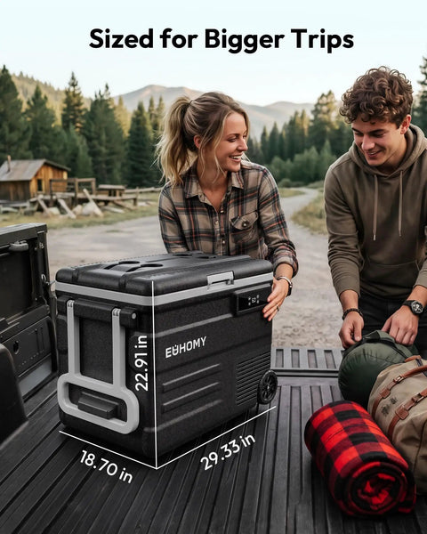 Smart 12V Car Fridge 59 Quarts With App Control And LCD Panel displayed by a woman and man outdoors, showing its size and features.