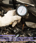 Mechanic using Compression Tester Kit For Engine Cylinders With Pressure Gauge Adapters, 8 Piece Set on vehicle engine