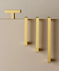 5 Pack Solid Brass Cabinet Pulls With Six And A Quarter Inch Hole Centers In Brushed Matte Gold displayed on beige surface