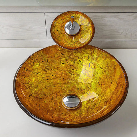 USZWBY Bathroom Vessel Sink,Tempered Glass Yellow Art Basin Round Bowl, 16.5" Bathroom Sinks with Waterfall Faucet and Pop Up Drain,Countertop Installation on a white countertop.