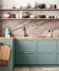 Modern kitchen with pastel dishes on open shelves and 5 inch brushed nickel cabinet pulls on green cabinets.