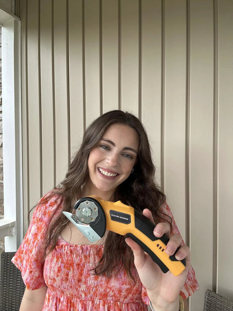 Woman holding Beast Cordless Scissors For Cardboard And Box Cutting Power Cutter With Rechargeable 4V Battery Safety Lock LED Work Light