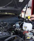 Pro Grade Pneumatic Brake And Clutch Bleeding Kit With Air Operated Action being used on car engine