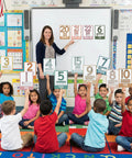 Teacher using Boho Number Card Set For Classroom 0 To 25 26 Pieces Math Poster Wall Chart For Preschool And Kindergarten.