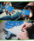 Person holding 100 Pack Lead Remover Wipes for Shooting Ranges and Industrial Cleaning, dirty hands, gun nearby on table.