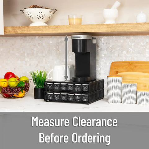 Two Drawer Coffee Pod Organizer With Removable Dividers Fits Up To 72 Pods Or Mix Of Pods And Office Essentials, Metal Mesh Coffee Station Base With Guided Drawer Track For Smooth Opening, Black Finish under a kitchen shelf with coffee maker on top
