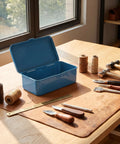 Kickass Vintage Iron Tool Box With Secure Locking Lid And Snappy Quick Access Compartments For Home Mechanic And Car Garage on workspace.