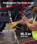 Worker securing load with Beefy Ratchet Chain Binder Set Five Sixteenth Inch Ten Foot G80 Chains 8000 Lbs Working Load on trailer