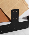 Rock Solid T Shape Steel Brackets Featuring Heavy Duty Metal Mending Plates, matte black finish, front view with screw holes.
