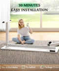 A woman assembles the SIAGO 48x24 Inch Electric Standing Desk, showcasing its easy installation process on a carpet.