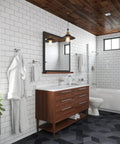 Bathroom interior with white tiles, wooden vanity, mirror, and bathtub. R89070K Brushed Nickel Modern 1-Handle Tub And Shower Trim Kit visible.