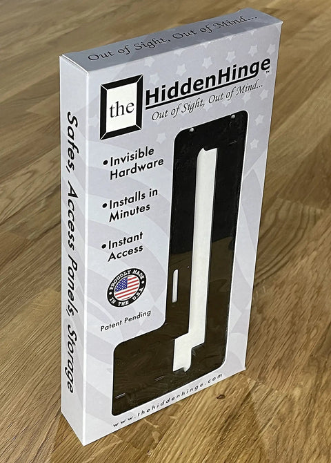 Hella Easy Invisible Picture Frame Hinges For Wall Safes And In Wall Stash Spots showing packaging with hardware, patent pending, plywood background.