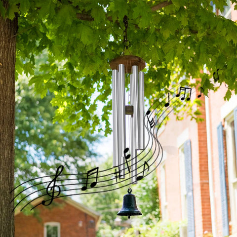 Front view wind chime with six silver metal tubes and a wooden top, hanging from a tree with a bell at the bottom