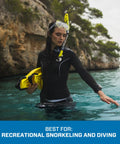 Person wearing Spectra Dry Snorkel With Purge Valve And Quick Connect Clip, Flexible Corrugated Lower Tube, in ocean view