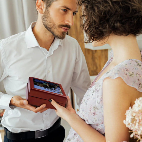Man presenting Rad Vintage Penang Rickshaw Ceramic Tile Jewelry Box Crafted From Polished Maple Wood to a woman.