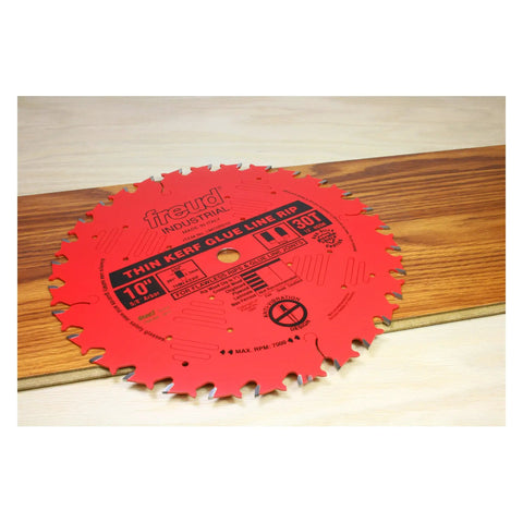 10 Inch Industrial Thin Kerf Glue Line Ripping Blade With TiCo Hi Density Carbide, 30 Teeth, 5/8 Inch Arbor displayed on wood