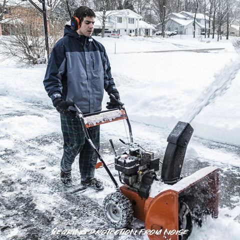 Man wearing Safety Bluetooth Earmuffs For Mowing And Power Tools With FM Radio NRR 29dB Industrial Hearing Protection in snow