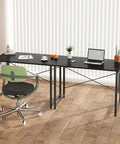 Black space saving computer desk for small spaces 31 inch home office table with steel frame and storage bag, in bedroom setting